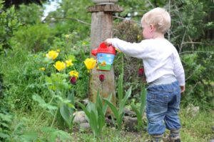 baby playing in garden
